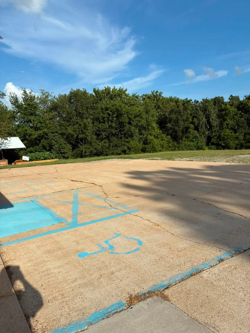 The same parking area after washing, with the concrete a lighter tan