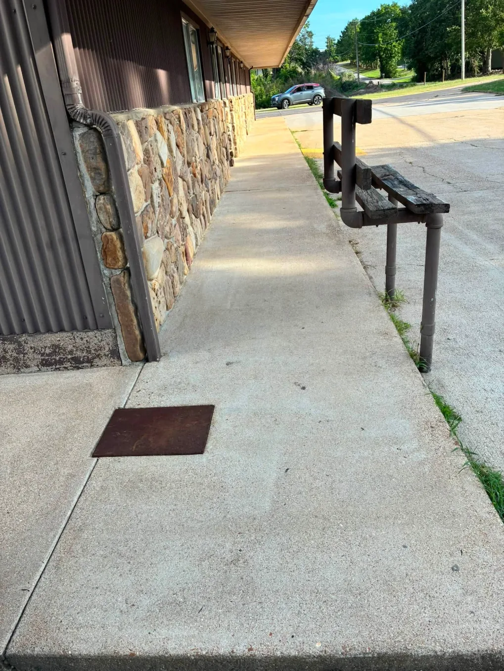 The same sidewalk after washing, lighter and cleaner